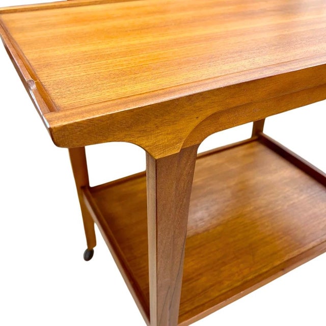 Vintage mid-century modern teak and Afromosia two-tier bar cart by Remploy UK. Perfect for use as a drink trolley or side...