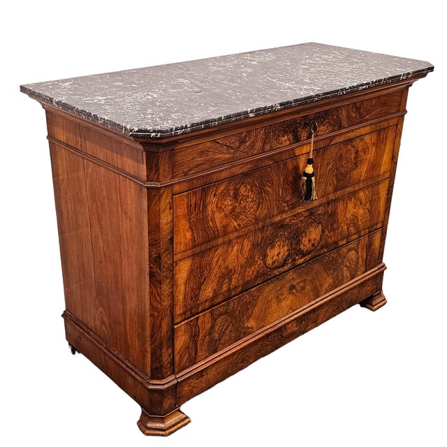 A substantial French Louis Philippe-period commode dating to circa 1830–1850, constructed as a four-drawer chest beneath...