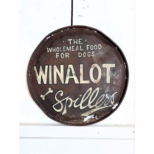Early 20th century Winalot dog food sign. An original piece, hand painted on an oil drum lid for a grocery shop in the...