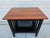 This great looking Arts & Crafts or Mission style side table features a cherry top and black lacquered base with lower...