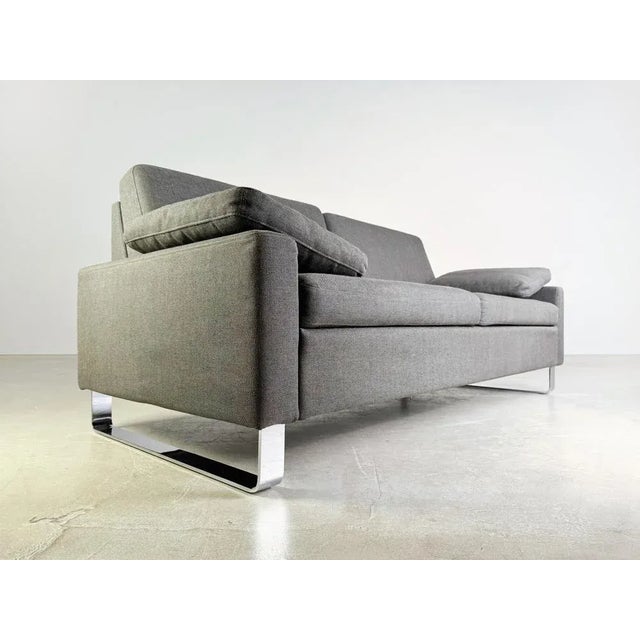 We are offering a total of 10 very well preserved and un/hardly used original Brühl Alba two-seater sofas in a modern dark...