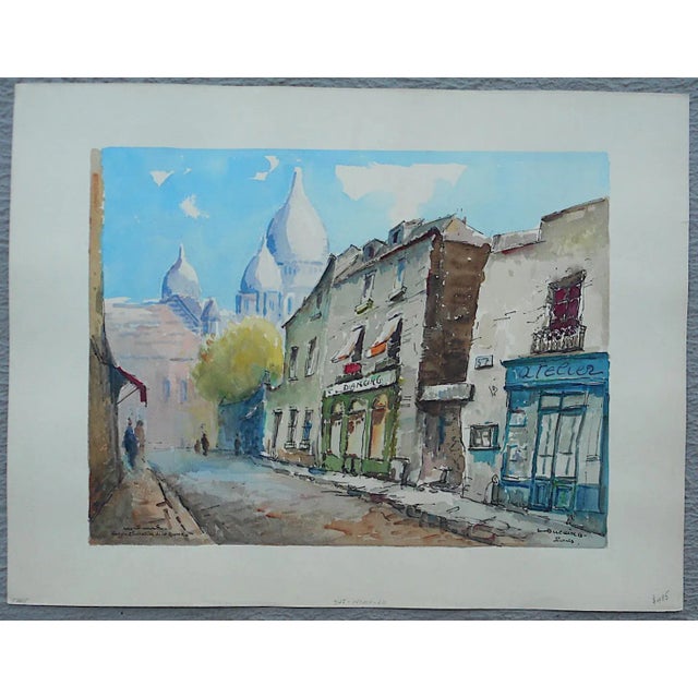 This fabulous mid 20th century large original signed watercolor depicts an avenue in Montmartre in Paris. Signed lower...