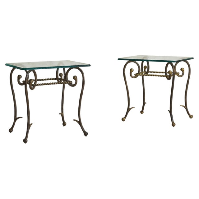 Material and gesture come together in this 1960s French accent table, where iron and glass are worked with equal...