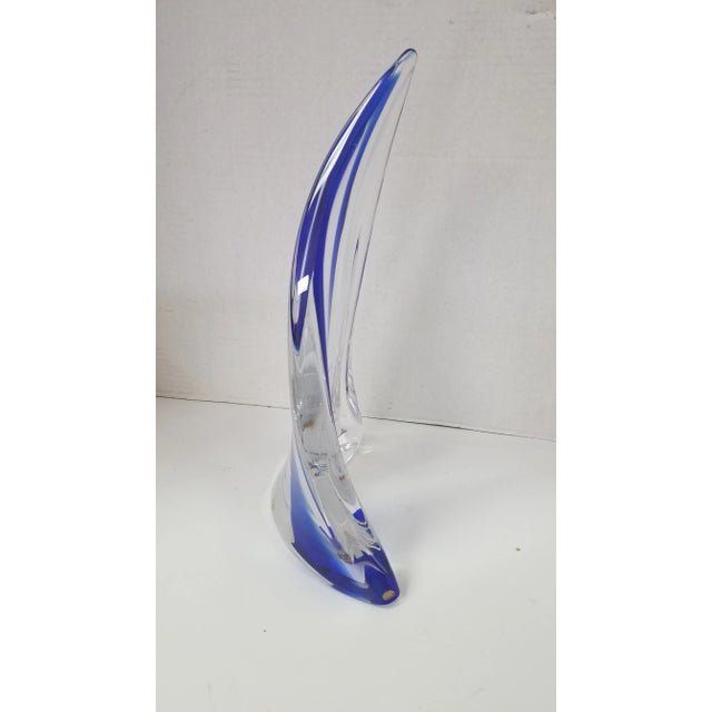 Vintage Hand-Blown Art Glass Sculpture. Clear glass with accent of navy Blue and White. The piece has small round bumpers...
