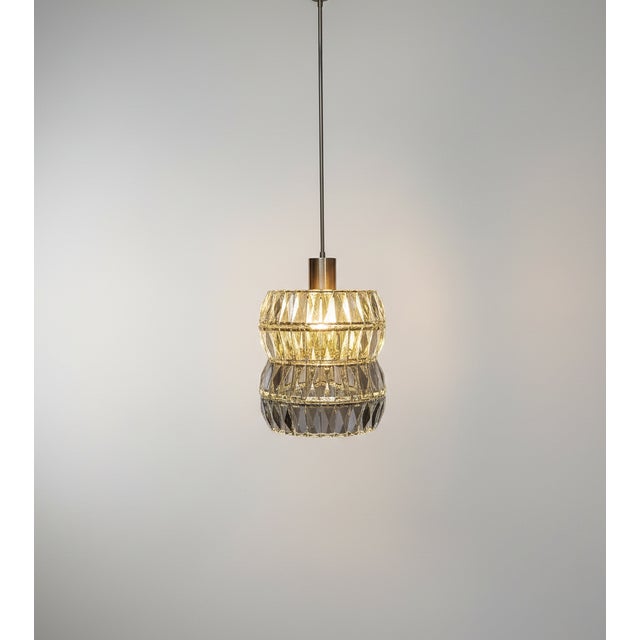 Elegant mid-century crystal pendant attributed to Bakalowits & Söhne, Vienna, circa 1950s. The lamp features layered rows...