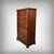 This superb mahogany and mahogany veneer chest of drawers captivates with the timeless elegance of its design and the...