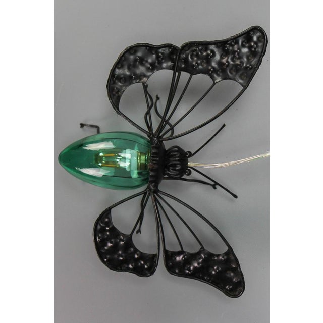 Mid-Century Modern metal and green Murano glass wall lamp butterfly, Italy, circa the 1960s. An extraordinary and...