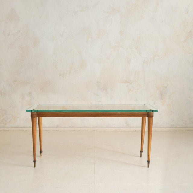 An Italian coffee table from the 1950s, crafted in the manner of Pier Luigi Colli. The rectangular frame is constructed...