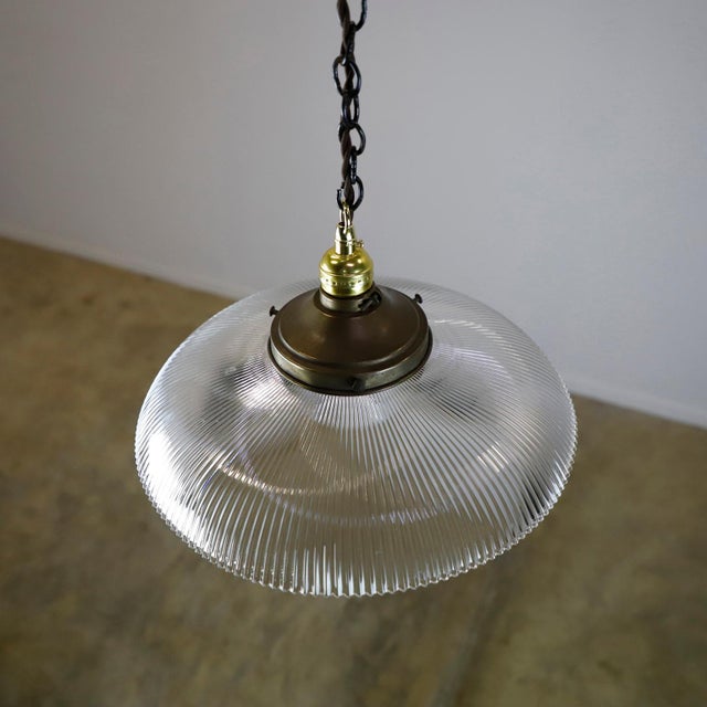 We offer this Holophane Clear Glass Vintage Industrial Pendant Light. Prismatic glass shades in excellent condition. The...