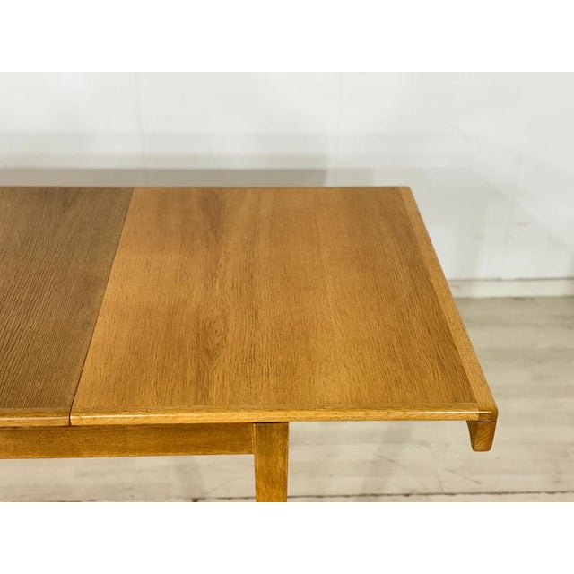 Original Danish dining table from the 1960s, designed by the renowned designer Erik Buch. This table impresses with its...