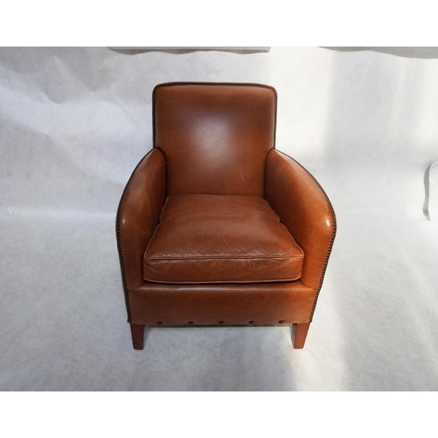Leather Poete Armchair by McNamara & Hirschman The chair is beautifully upholstered in a rich Chestnut-colored leather...