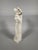 19th-century alabaster sculpture depicting a woman in the style of ancient Greece draping herself after her bath. French...