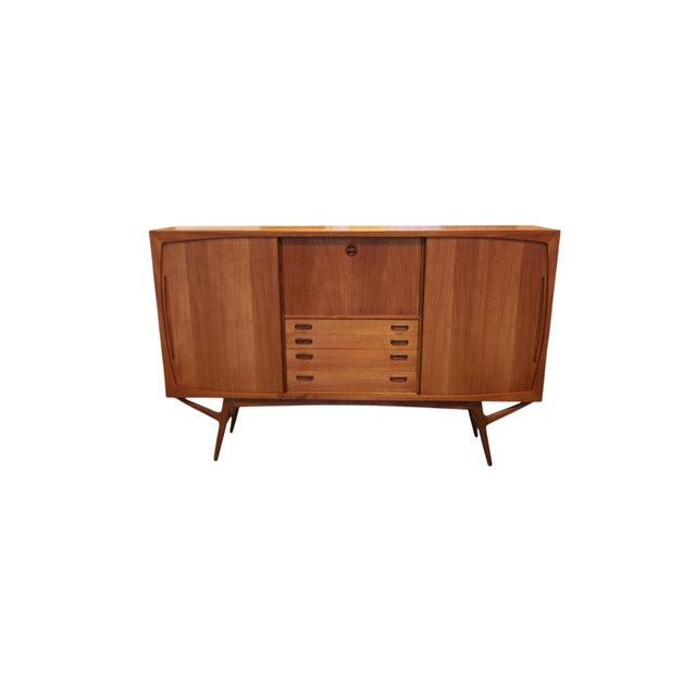An incredibly beautiful Danish teak cabinet, designed by Harry Østergaard for A/S Randers Møbelfabrik in the 1960s. Here,...