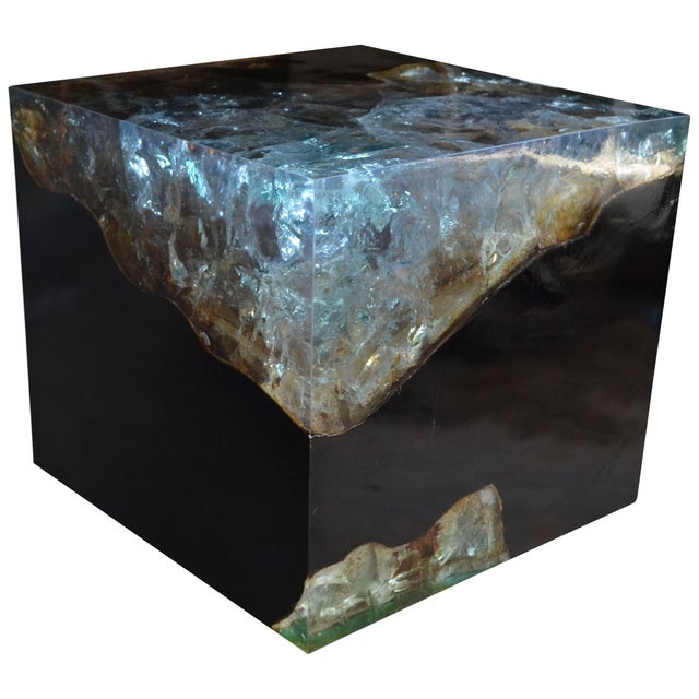 The cracked resin side table is made from teak infused with resin. A dramatic piece due to the depth of the resin, which...