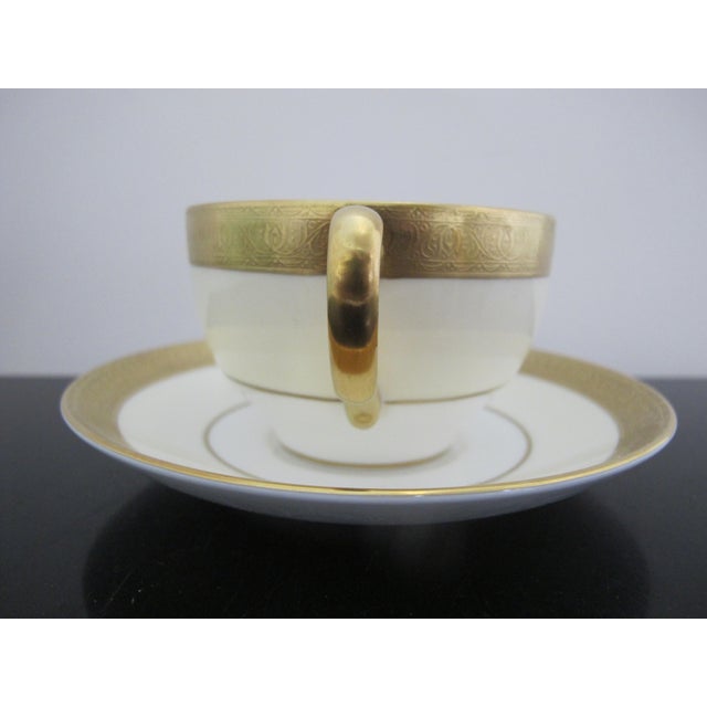 Gorgeous Minton Buckingham cup and saucer with elaborate gold gilt rim. Hallmarks at base, K159. Cup measures 4.5" x 3.5"...