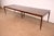 An exceptional Mid-Century Modern sculpted walnut extension dining table By Kipp Stewart for Directional and produced by...