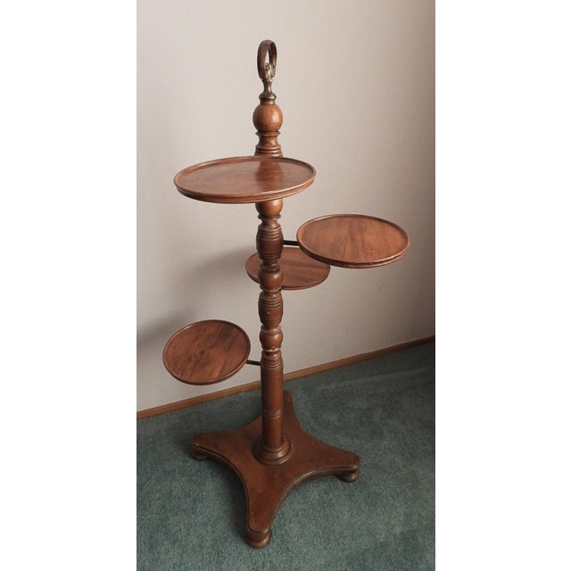 This marvelous Butler Furniture plant stand or wine display stand is created in gorgeous walnut hardwood and has four...