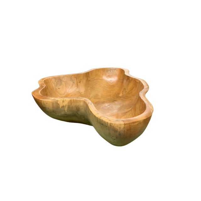 This teak live edge bowl is a unique piece showcasing the natural beauty of teak wood. Crafted by skilled artisans, its...