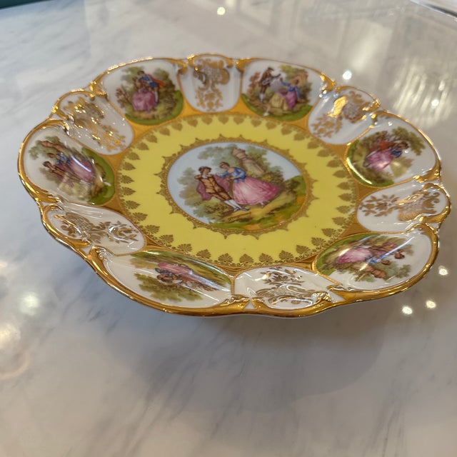 Design Plus Gallery presents a Yellow Dinner Plate with STW Bavaria. It has a raised base and a scalloped edge with...