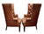 On offer is a pair of high-quality Chesterfield-style barrel back armchairs that recall quiet English evenings by the fire...
