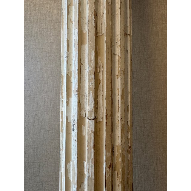 A vintage striking pair of tall fluted columns, presented as sculptural objects rather than architectural fragments. Wabi-...