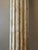 A vintage striking pair of tall fluted columns, presented as sculptural objects rather than architectural fragments. Wabi-...