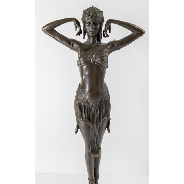 We are offering this mid-century casting after Virtue by Demetre Chiparus. This bronze casting of an orientalist belly...