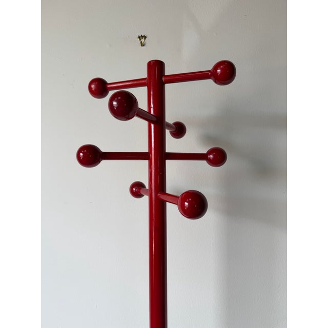 Striking 1980s Italian postmodern coat rack crafted in solid beech wood with a bold red stained finish. Featuring a...