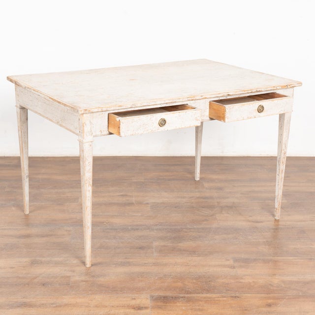 Antique Swedish Gustavian gray painted pine "partner's desk" with two drawers on each side of the table and traditional...