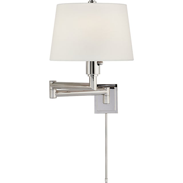 Chunky Swing Arm in Polished Nickel with Linen Shade Designer: Chapman & Myers Finish: Polished Nickel Height: 18.25"...