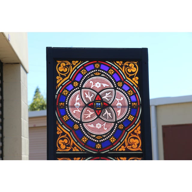 Exceptional pair of antique Victorian Gothic stained glass windows dating to approximately 1900, featuring extraordinary...