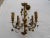 An antique c1910 French Louis XVI style bronze Maison Jansen foliate/ ribbon/ tassel/ drape form 4 light chandelier.
