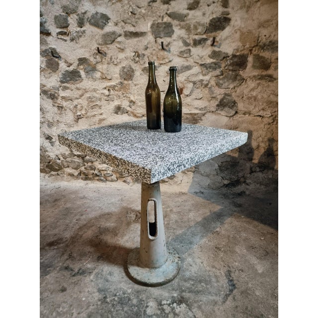 This industrial bistro or garden table originates from France and dates from the mid-20th century. It features a cast iron...
