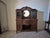 This is a unique and striking late 19th century buffet is in exceptional condition with a beveled mirror, four beautifully...