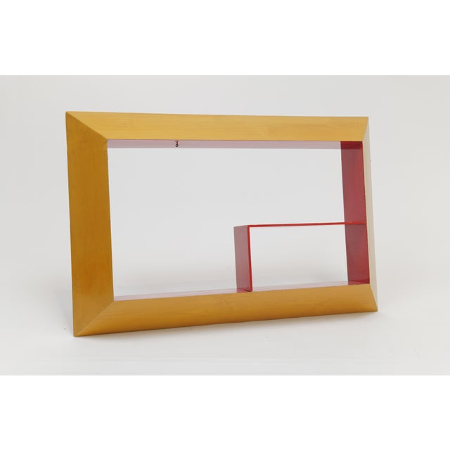A dynamic and graphic Mid-Century Modern shadow box wall shelf, featuring an asymmetrical geometric composition and bold...