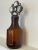 Vintage Amber bottle adorned with stained glass and light Amber crystals. Styled in the fashion by glass artist, Karla...
