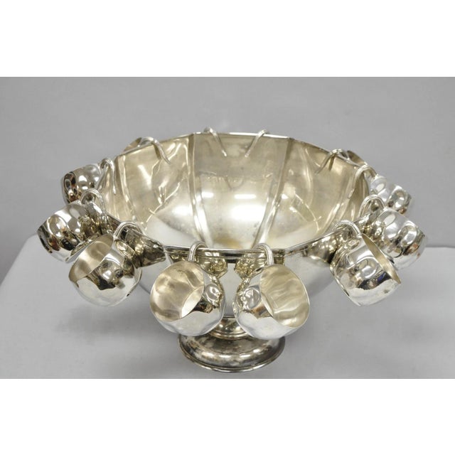 Vintage Modern Regency Style Silver Plated Pedestal Base Punch Bowl with 12 Hanging Cups. Circa Late 20th Century....