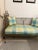 French metal wire settee with a beautiful aged finish Silk plaid long bottom cushion and 2 pillows are in perfect condition