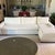 This Restoration Hardware sectional features a clean, modern design with a right-facing chaise. The soft beige upholstery...