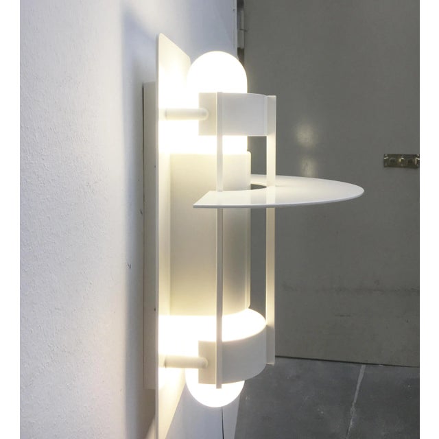 The Saturn outdoor wall lamp by the Danish lighting manufacturer Louis Poulsen in the ''huge'' Maxi version. The Saturn...