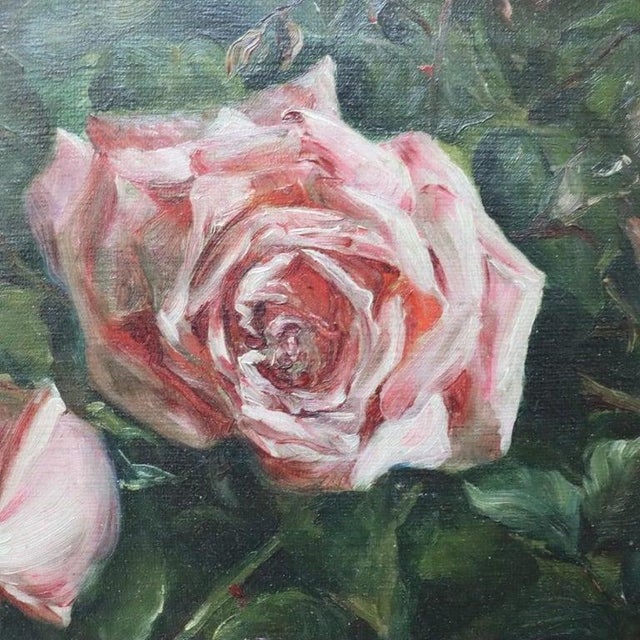 An exquisite antique oil on canvas painting presents a floral still life composition featuring lush pink roses, rendered...