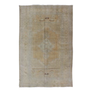 Vintage Turkish Oushak Rug in Faded Gold and Soft Gray With Subtle Medallion 3′6″ × 5′9″ For Sale