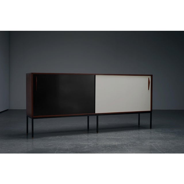 In the manner of Charlotte Perriand period: 1960s origin: France dimensions: h89 x w198 x d38 cm material: metal, wood