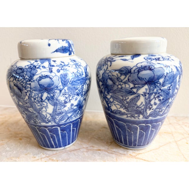 This is a beautiful pair of circa 1940's Vintage Chinese Blue & White (Qing Dynasty Style) Ginger Jars with distinct hand...