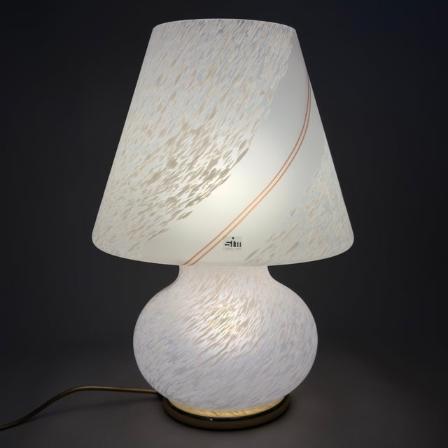 A lighting masterpiece that perfectly embodies the flair and sophistication of 1970s italian design. This imposing and...