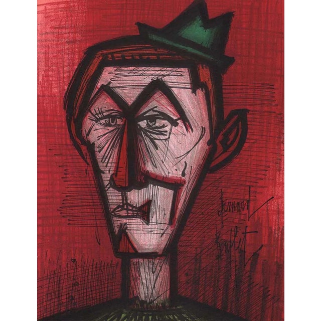 Artist: Bernard Buffet Country: France Title: The clown on red background Medium: Original Lithograph Marks: Signed in...