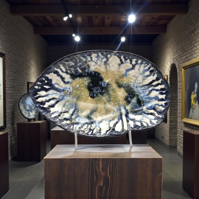 An organic studio pottery dish by Edgecomb Potters, Maine, showcasing a crystalline glaze surface characterized by...