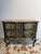 A curved, lacquered, and painted chest of drawers from the first half of the 18th century. Sicily. This piece is...