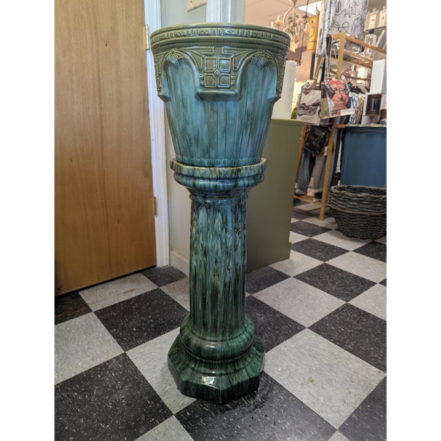 Beautiful Glazed Indoor Urn on matching pedestal. The urn is stamped on the bottom. There is a small chip on the edge of...