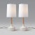 White Ceramic Base, Oak Neck, White Muslin Lampshade. Thoughtful attention to detail went into the making of this mid-...